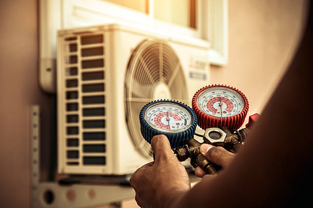 Professional Air Conditioning Service technician working in Bremen, IN